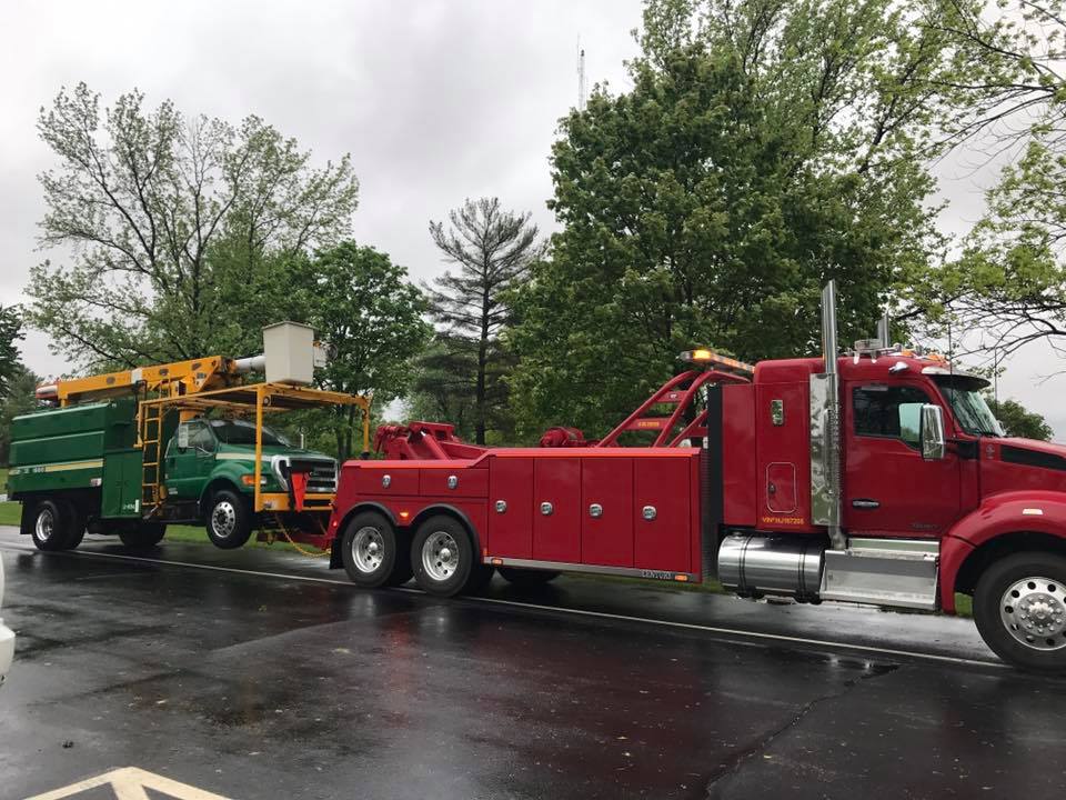 Truck Towing a Green Van